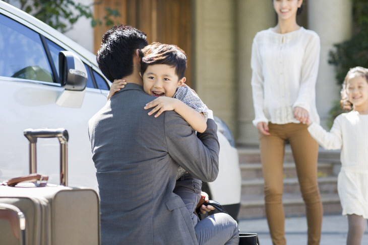 Son greeting returning father