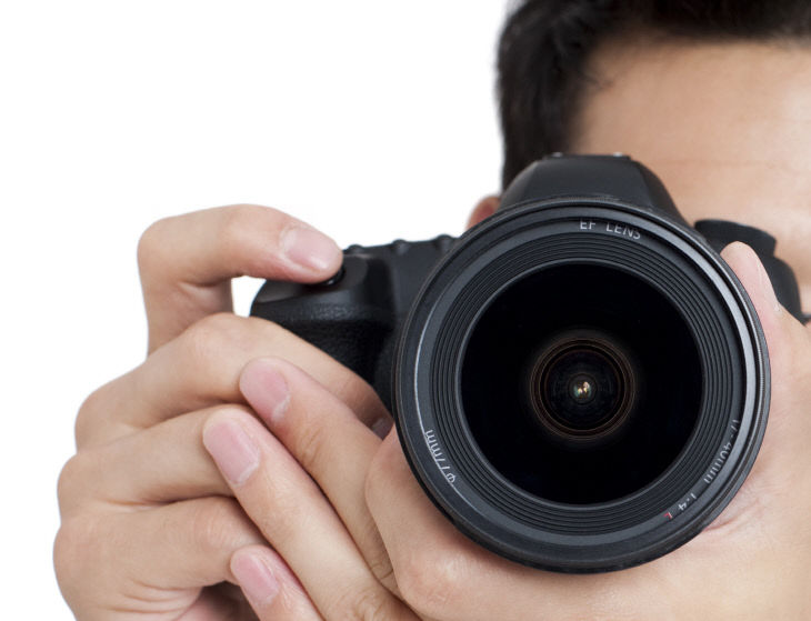 Young man taking photos